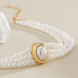 Short faux pearl and turquoise bead necklace